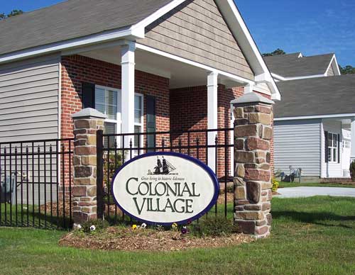 Calico Faux Stone Pillar with Ornamental Fence